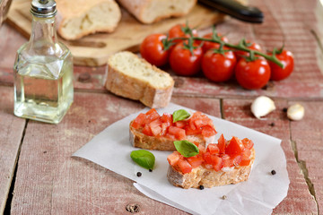 Tomato bruschetta - bread toast with tomatoes, garlic