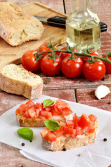 Tomato bruschetta - bread sandwich with tomatoes, garlic