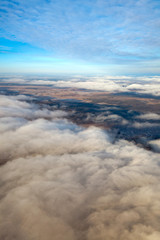 Flight between clouds during sunrise