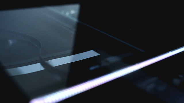 Flat bed computer scanner in action.