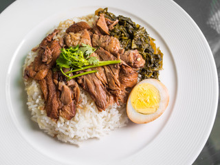 stewed pork leg on rice with boiled egg and preserve