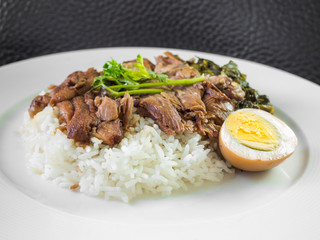 stewed pork leg on rice with boiled egg and preserve