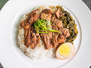 stewed pork leg on rice with boiled egg and preserve