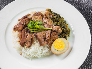 stewed pork leg on rice with boiled egg and preserve