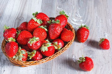 Fresh strawberries on wood background