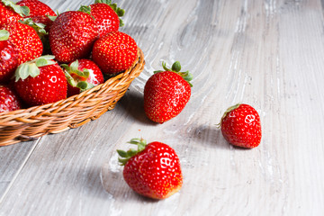Fresh strawberries on wood background