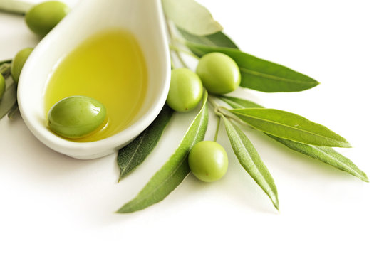 Olive Oil And Green Olives Isolated