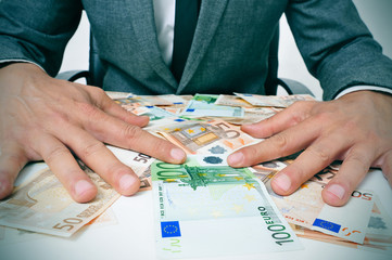 man in suit with euro bills