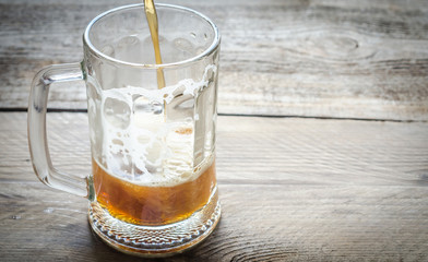 Beer pouring into mug