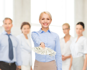 young businesswoman with dollar cash money