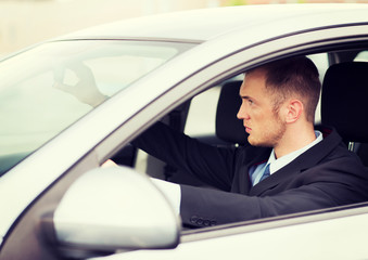 businessman driving a car