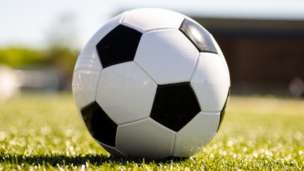 Fototapeta premium Soccer ball in the sun
