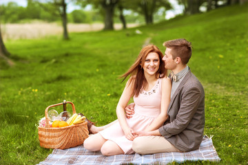 Couple in love in sitting near the river picnic. Valentine's Day