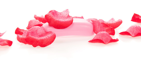 Fototapeta premium Toilet soap under petals of the roses