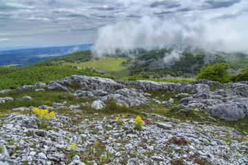 Beautiful mountain scenery in the Alps in summer and clouds