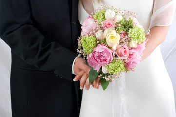 Wedding couple holding hands