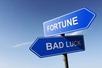 Fototapeta premium Fortune and Bad luck directions. Opposite traffic sign.