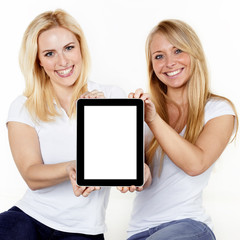 Women presenting tablet pc with copyspace