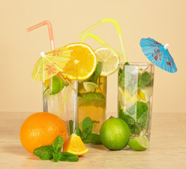 Tea with a lemon, orange drink and cocktail
