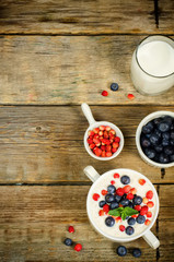 oatmeal with blueberries and strawberries in the white bowl