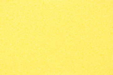 Obraz premium Yellow sponge texture. Abstract background image of bath sponge