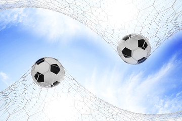 Soccer football in Goal net with Blue sky