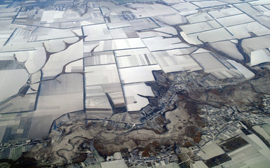 view of Earth from a height covered with snow during 