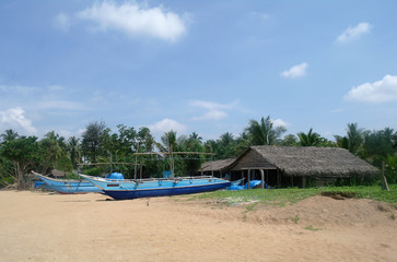 Exotic fisherman boat on beach near the ocean