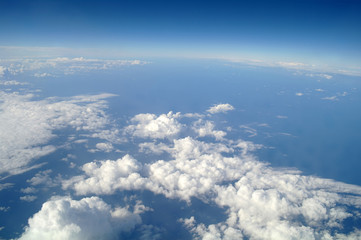 clouds and blue sky seen from plane