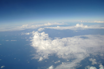 Fototapeta premium clouds and blue sky seen from plane