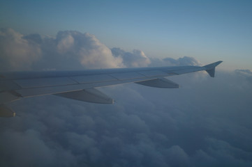 Fototapeta na wymiar Flying above clouds