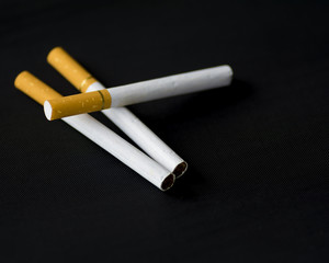 Cigarettes isolated on black background.Selective focus