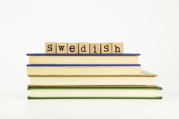 swedish language word on wood stamps and books