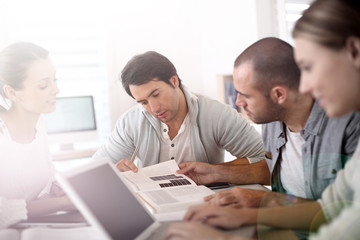 College people studying together in school lounge