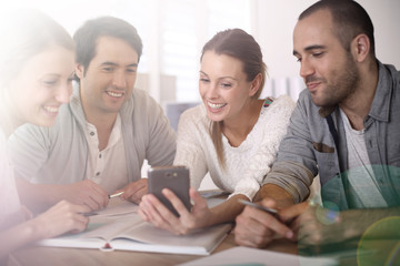 Group of business people in office using smartphone