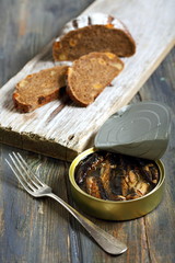 Canned fish in a tin.