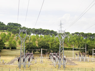 power plant with pylons and transformers, view from above