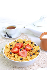 Breakfast - cornflakes with  strawberries and blueberries