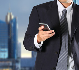 Cropped view of Businessman holding phone