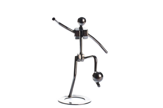 Iron toy footballer isolated on white