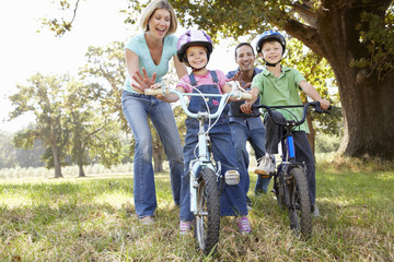 Parents with young children on bikes