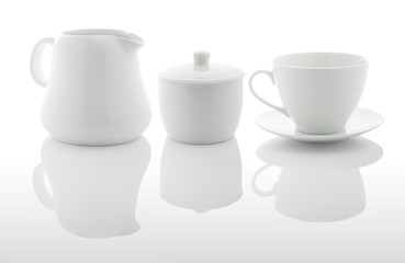 White milk jug, sugar bowl and coffee cup