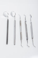 Set of Dental Tools for Teeth Treatment  Isolated on White Backg