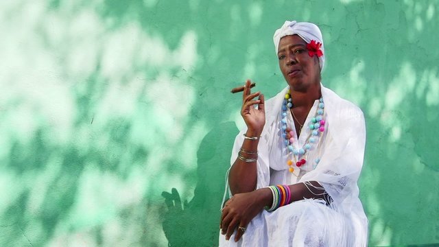6of11 Portrait of old black cuban woman smoking cigar