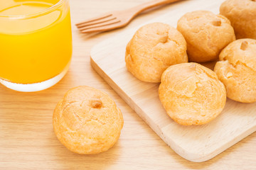 Cream puffs and orange juice