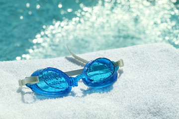 Fototapeta na wymiar Swimming goggles on towel