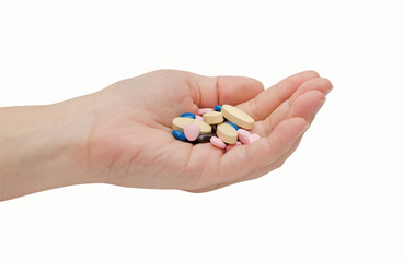 Hand with medicine pills isolated on white background