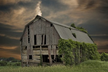 dilapidated barn with sunset sky