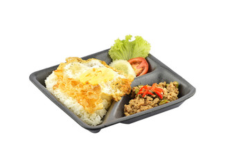 Rice topped with stir-fried pork and basil with fried egg on whi