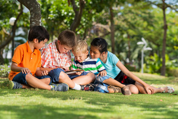 Children with digital tablet